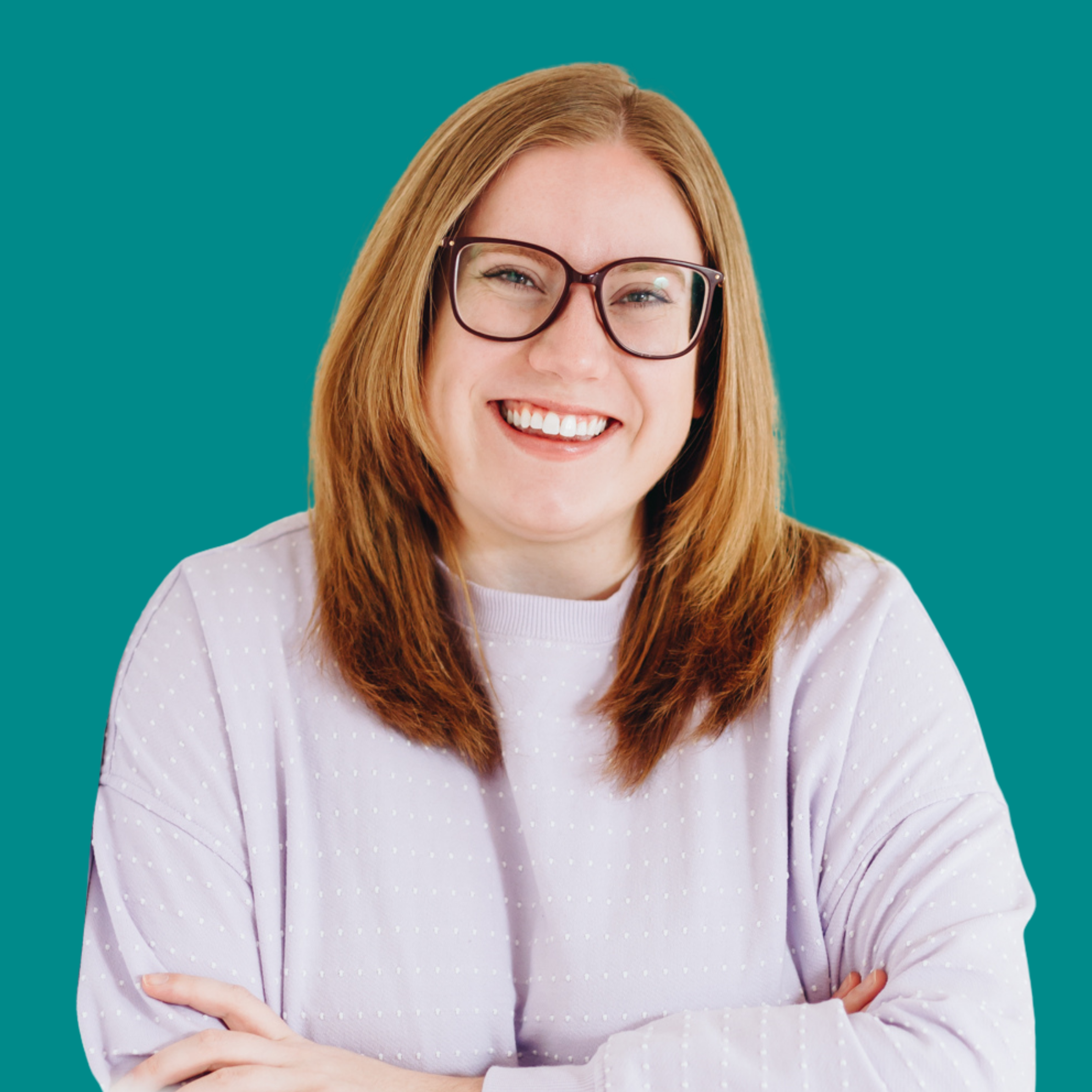 Headshot of Sarah Lamb, Registered Psychotherapist, smiling with arms crossed against a teal background, wearing glasses and a light lavender sweater.